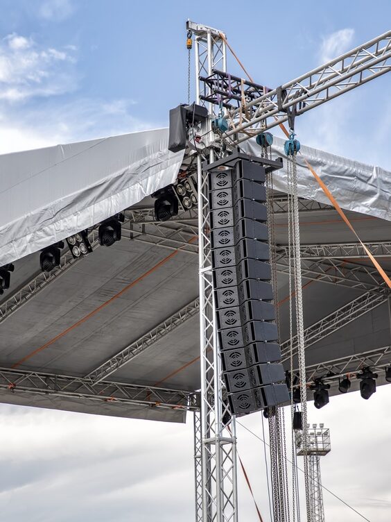 stage lighting and sound equipment on the outdoor stage before a concert